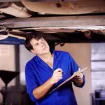 mechanic performing an undercar inspection